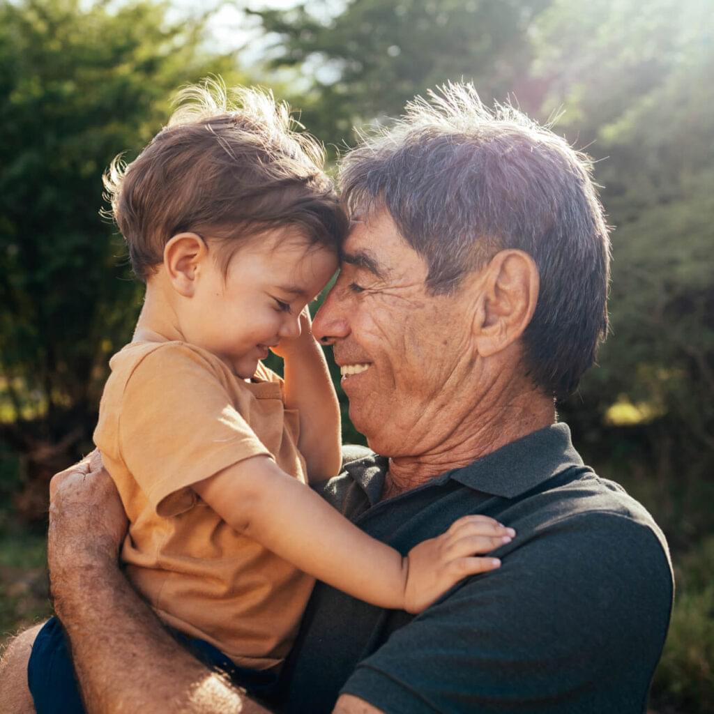 Playful grandfather spending time with his grandson